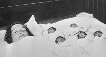 Elzire Dionne with her quintuplet daughters